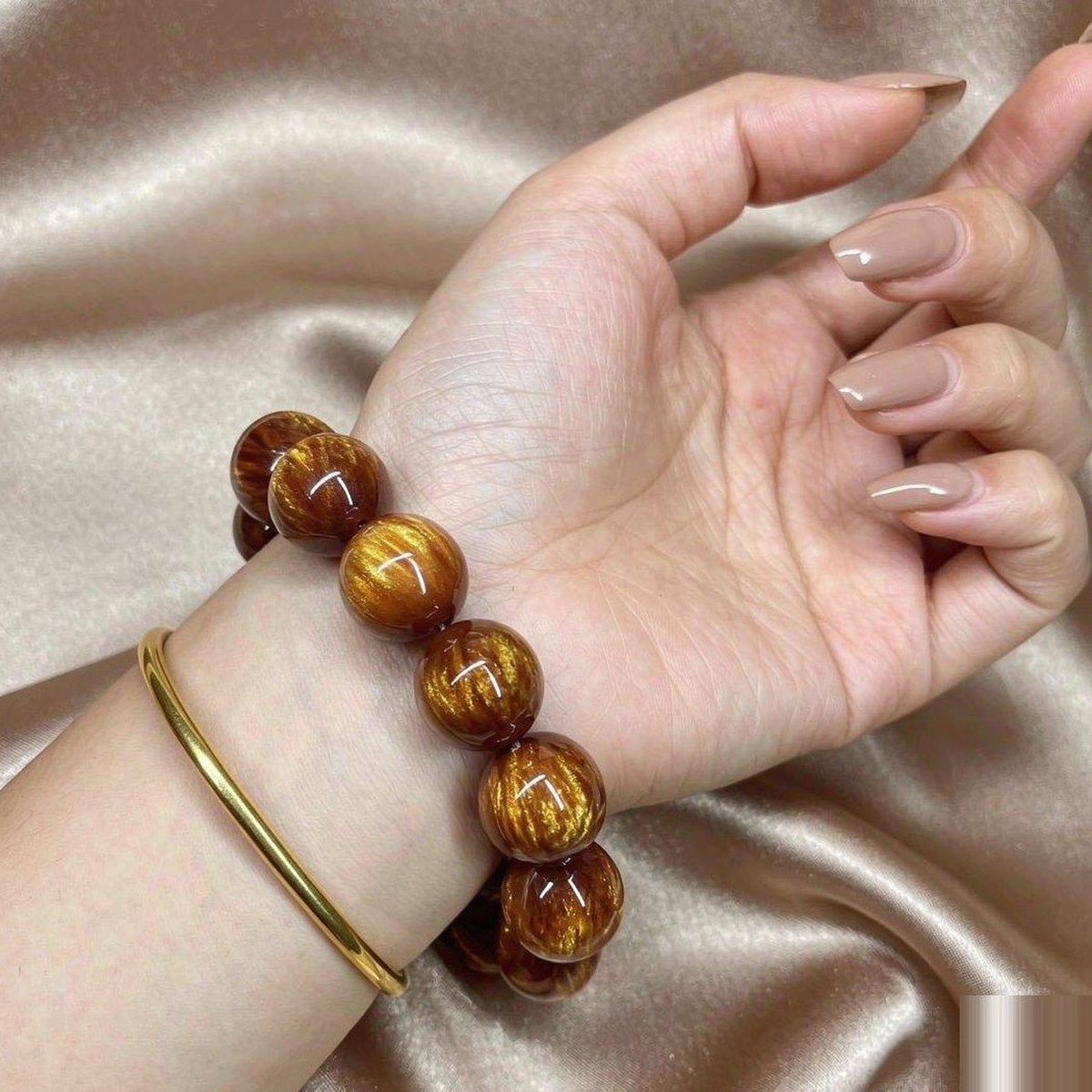 BEADORO Sunstone 20 mm resin beaded bracelet - worn on a wrist